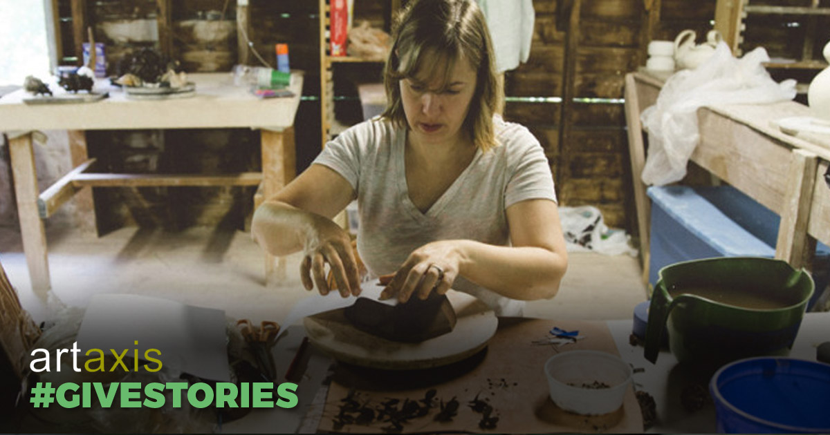 A woman at the pottery wheel with the words "Artaxis #Givestories"
