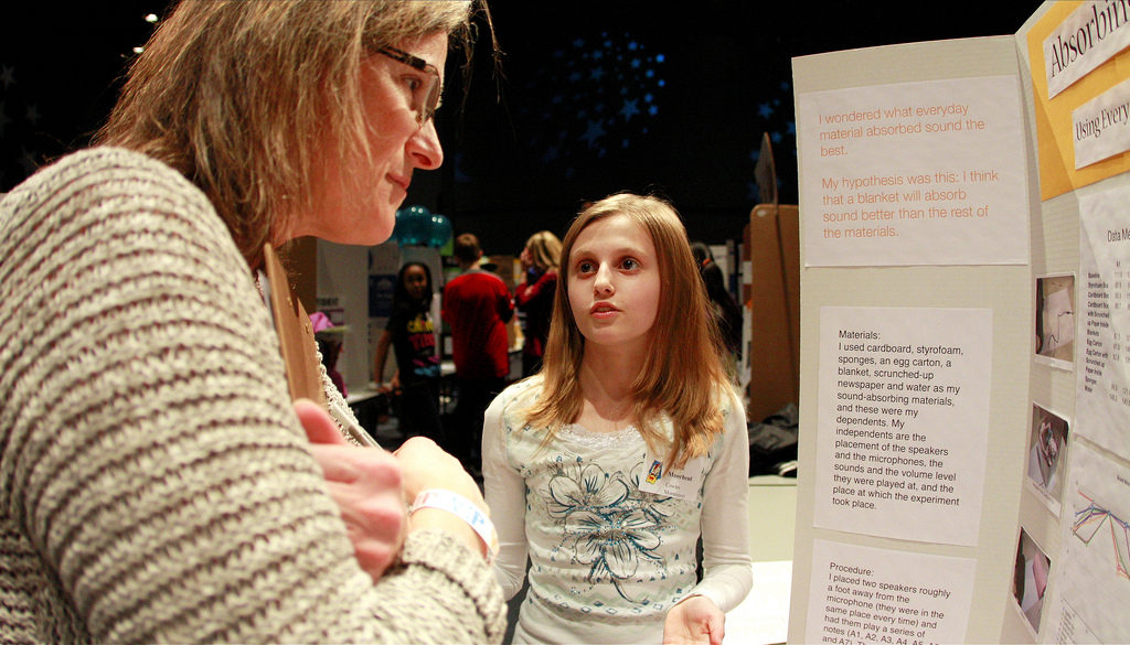 Child and teacher at science fair
