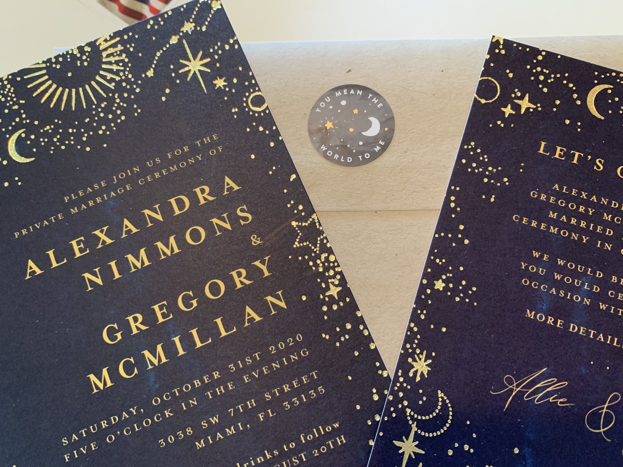 Allie and Greg's wedding invitations are black and gold. 